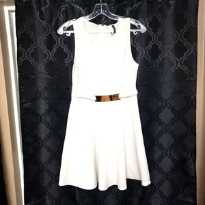 Short white dress,size large, polyester,spandex with a gold plated belt